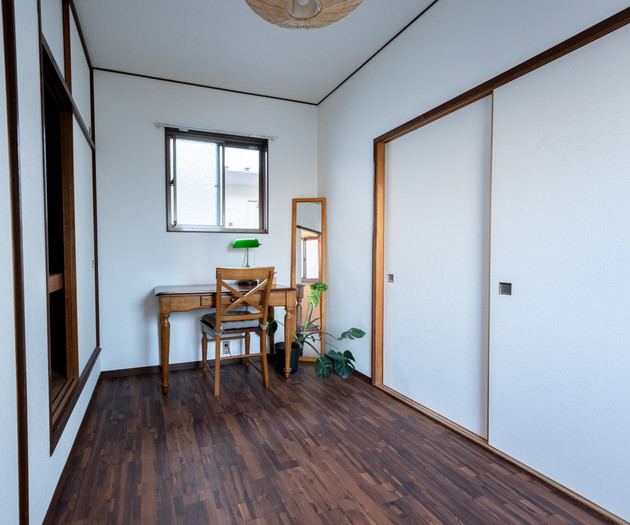 Bedroom with desk and closet