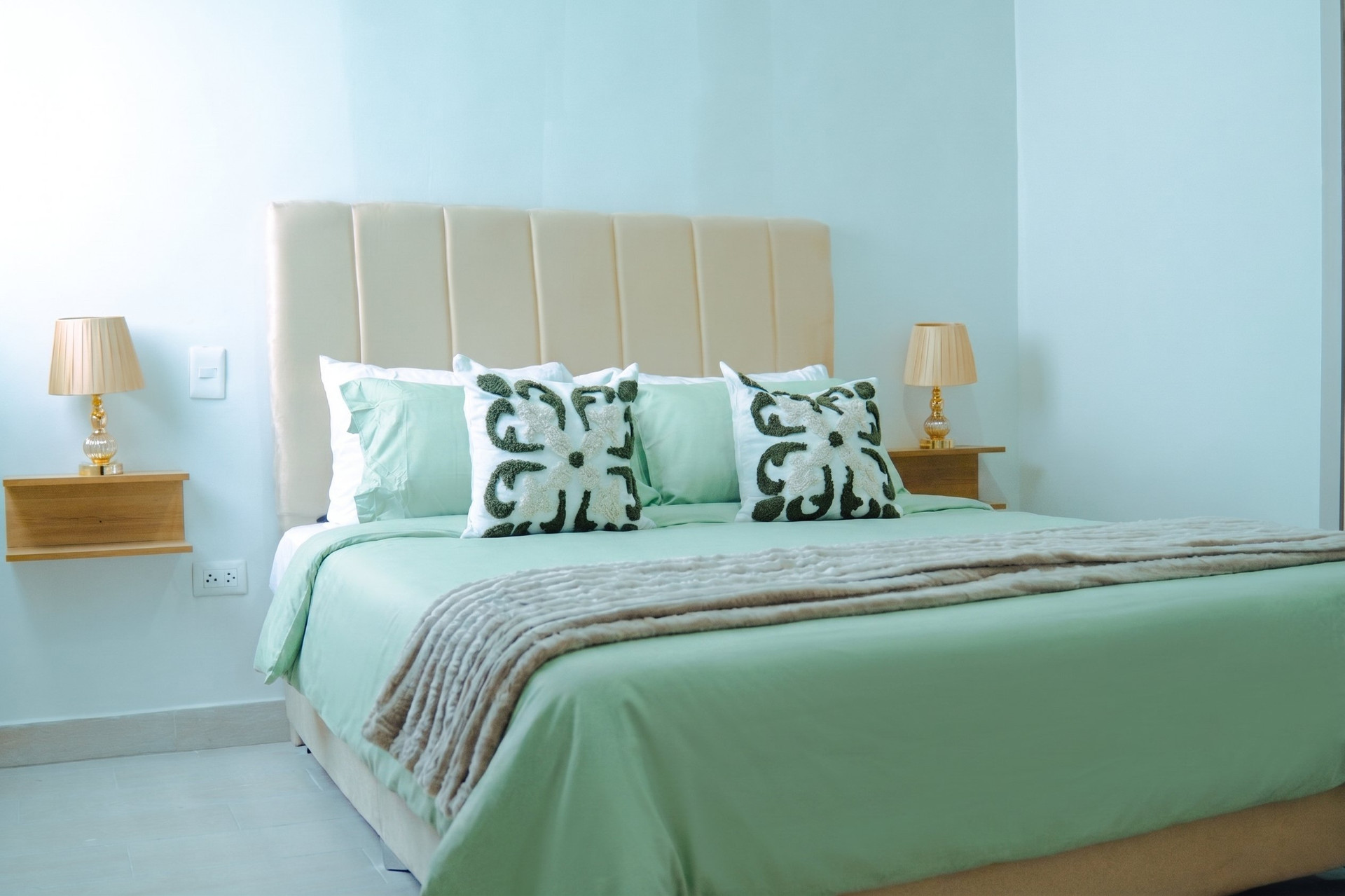 Master bedroom with green bedding