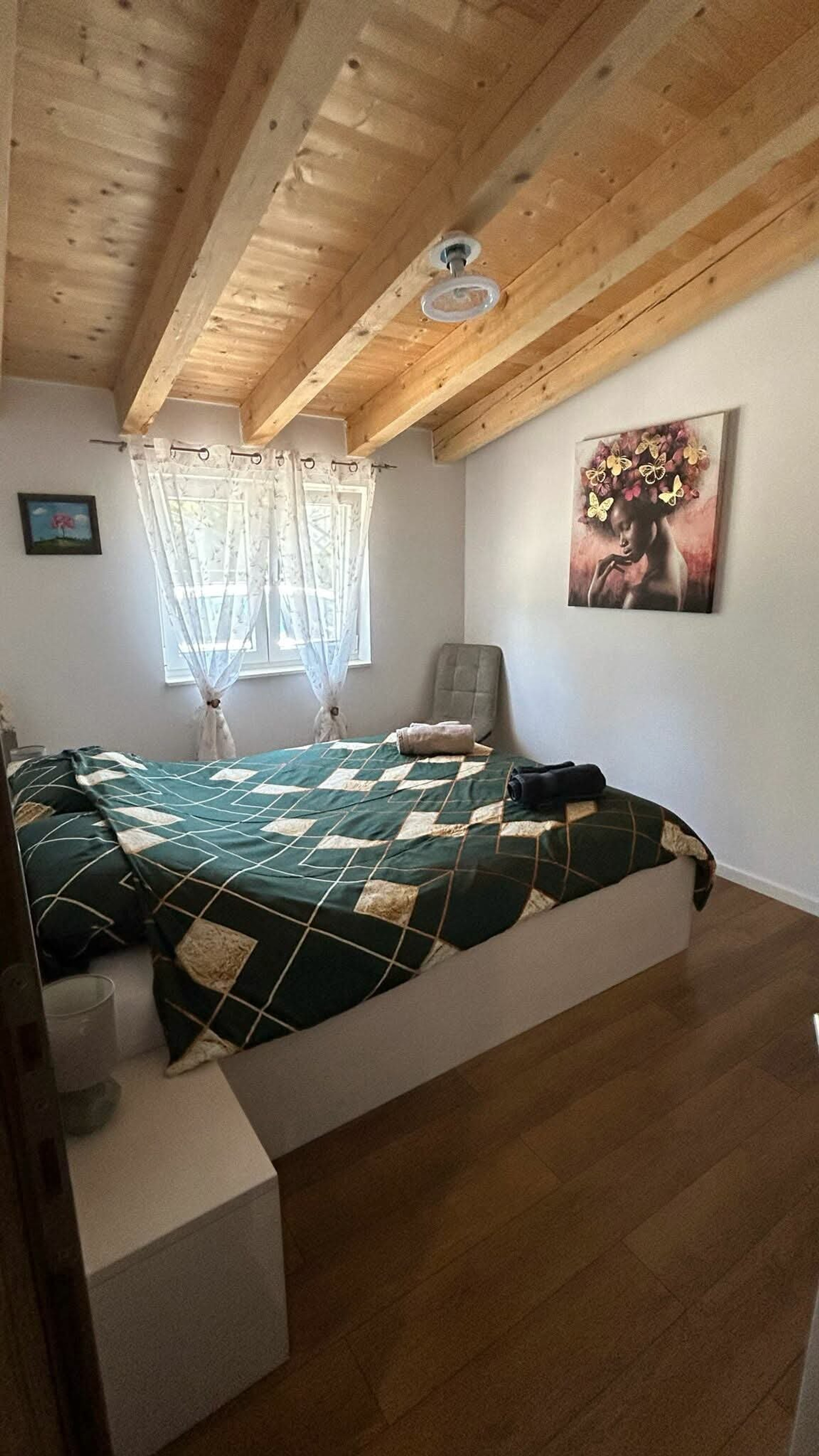 Bedroom with green patterned bedding