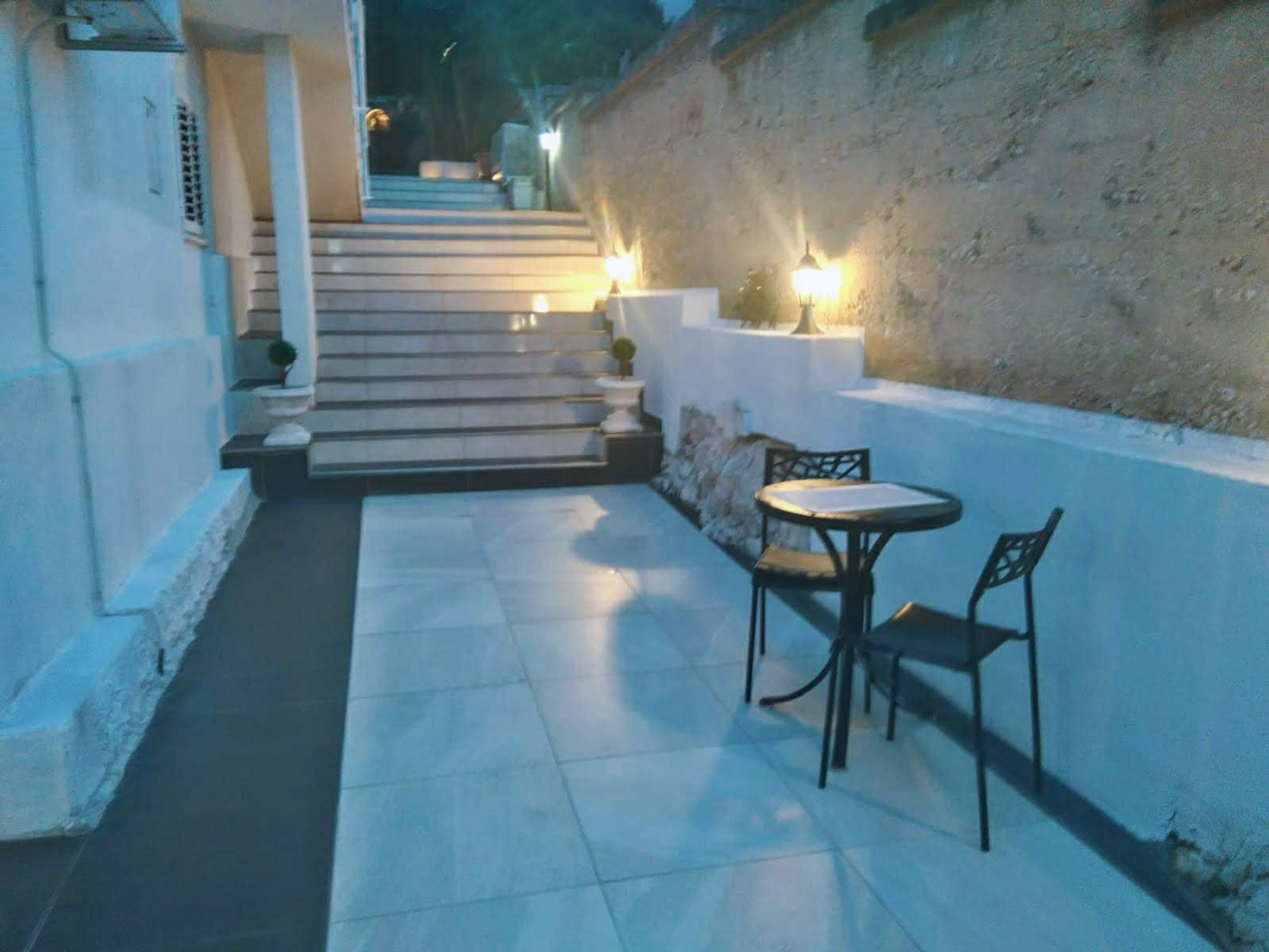 Evening terrace with stairs and table