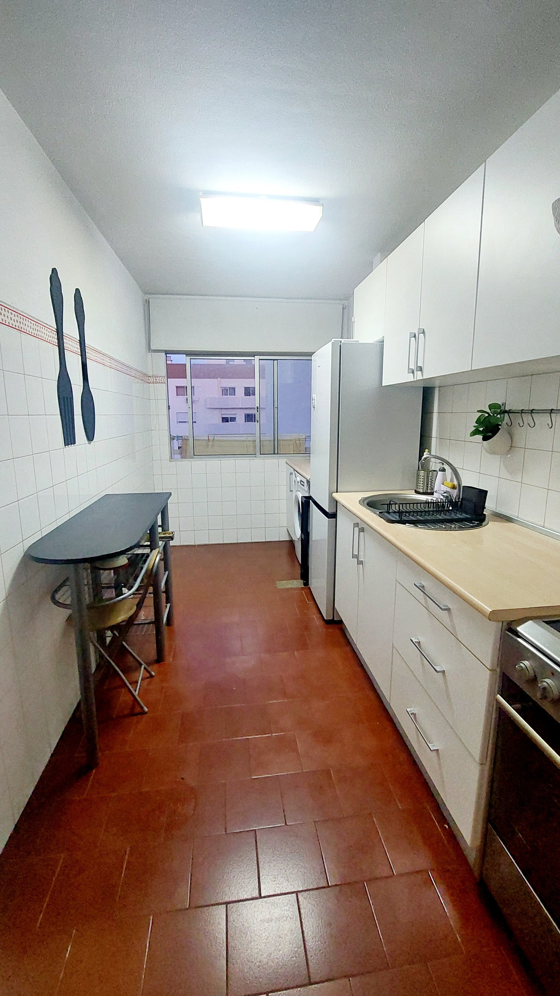 Full kitchen overview with window