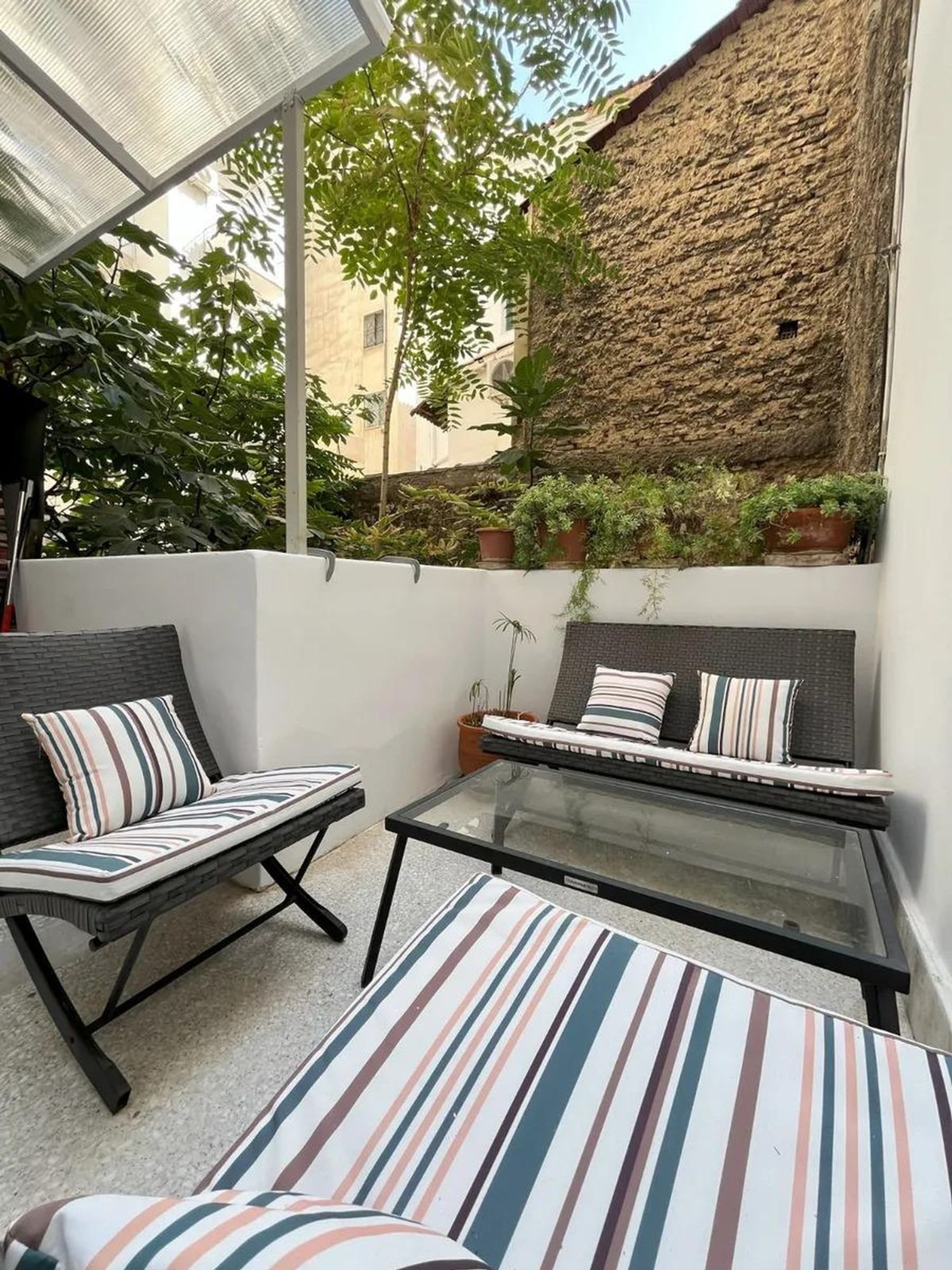 Patio seating area with greenery