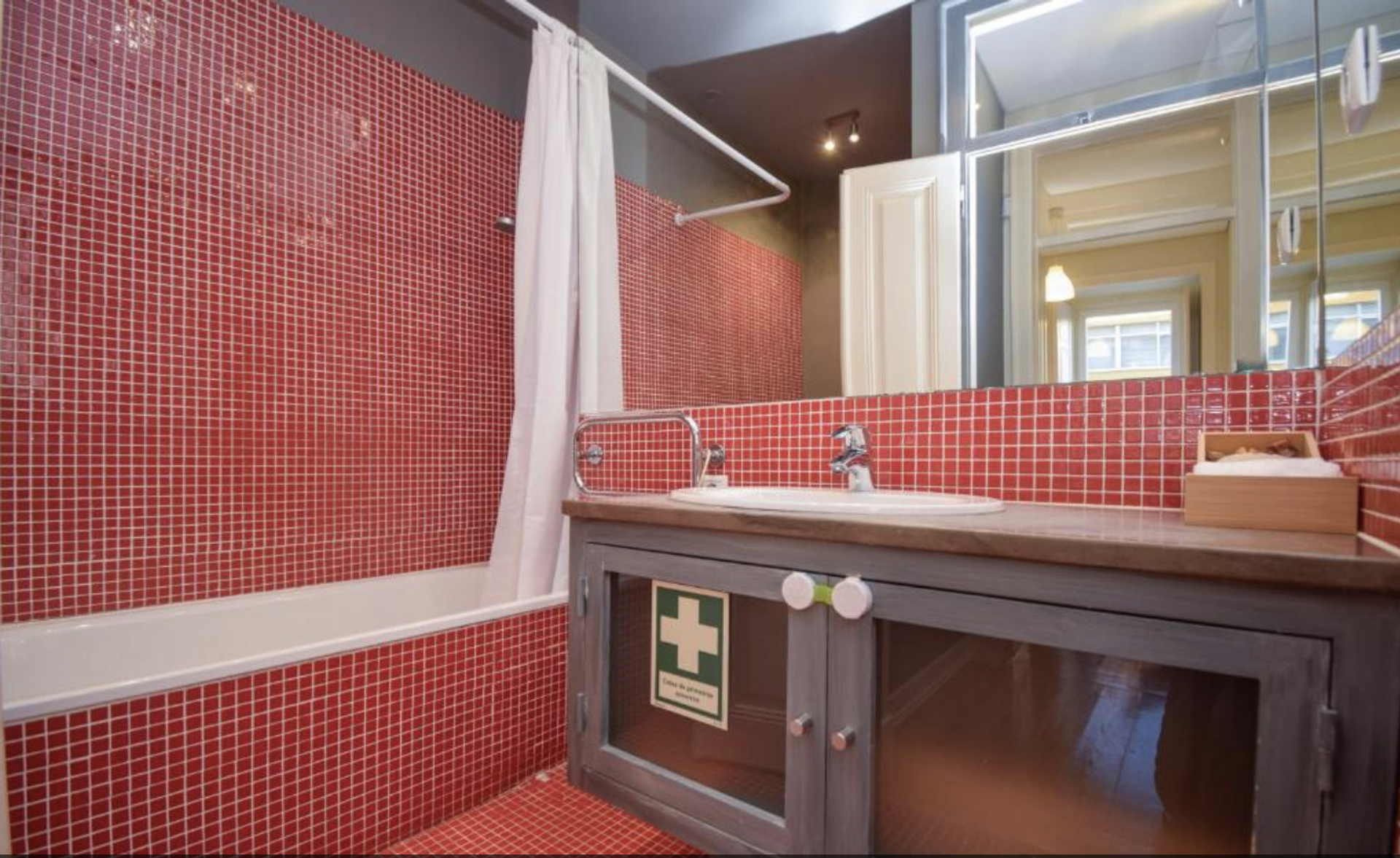 Red mosaic tiled bathroom