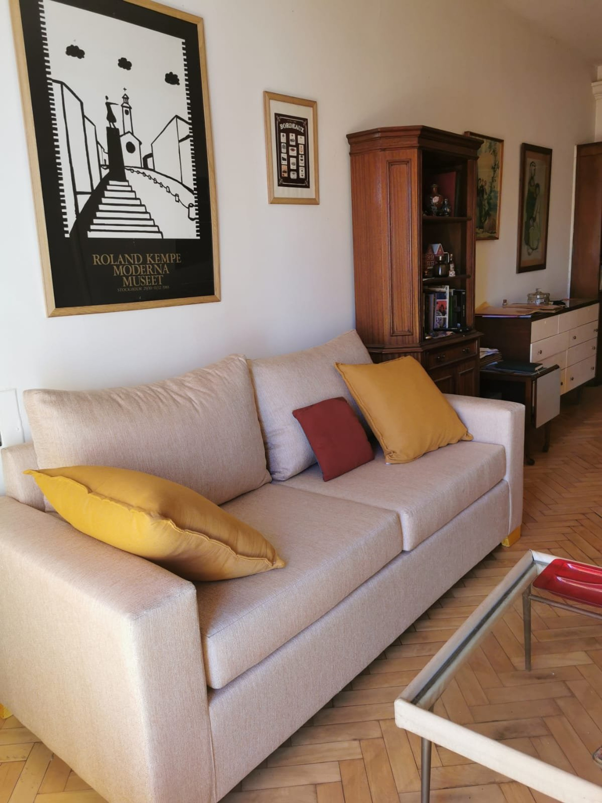 Living room with sofa and herringbone floor