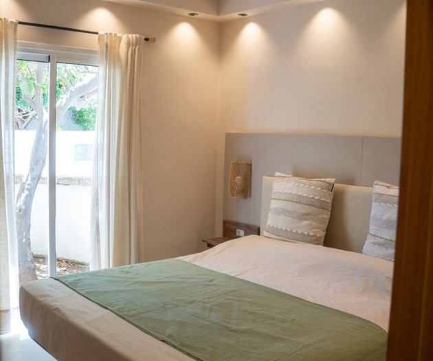 Bright bedroom with balcony access