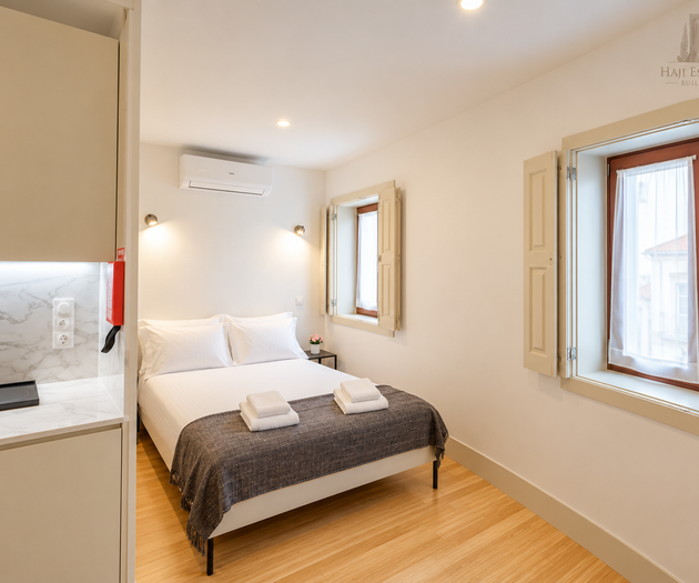 Bed alcove with two windows