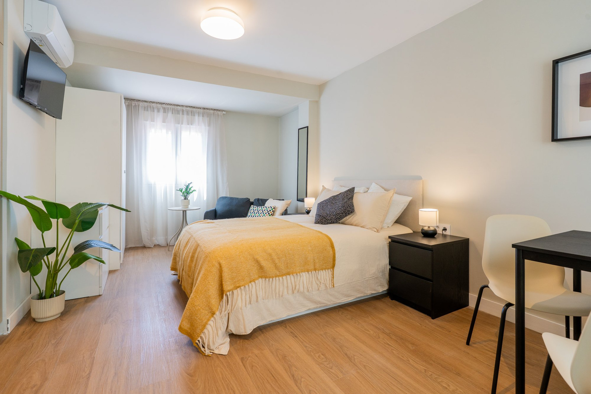 Bright studio with bed and table
