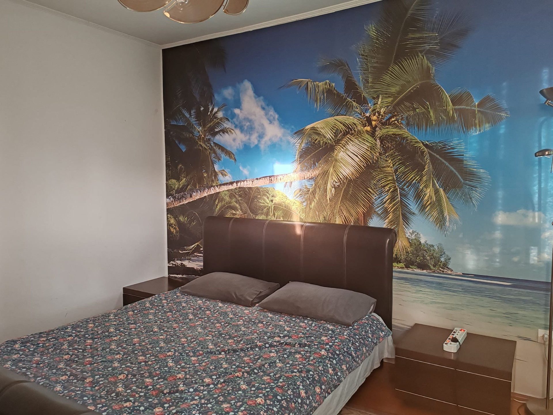 Bedroom 1 with tropical palm mural