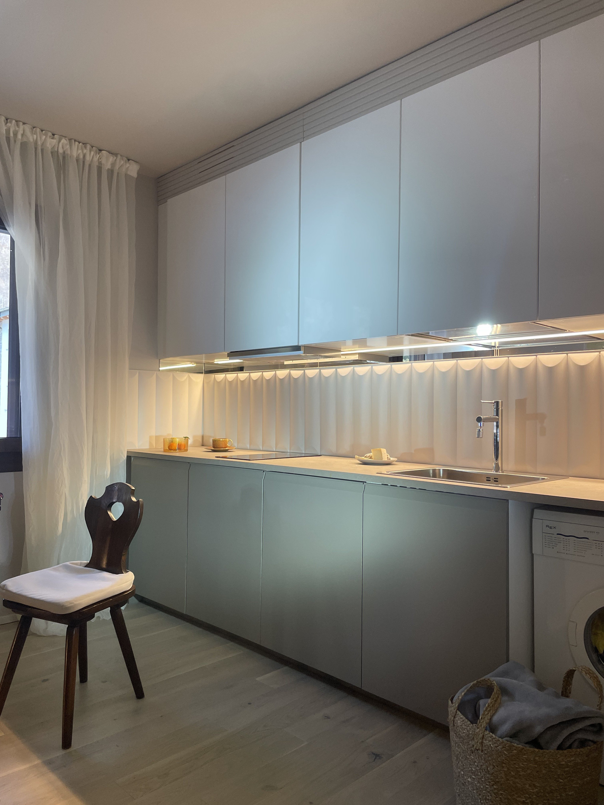 Modern kitchen with sage cabinets