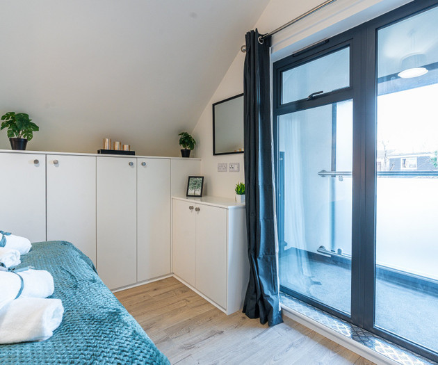 Bedroom balcony door and cabinets