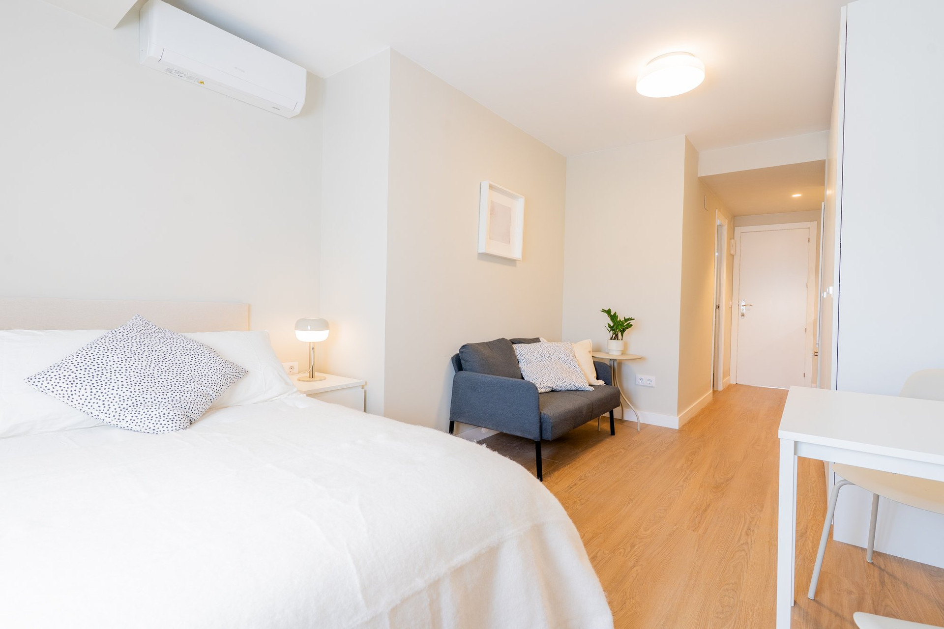 Studio bedroom with AC unit
