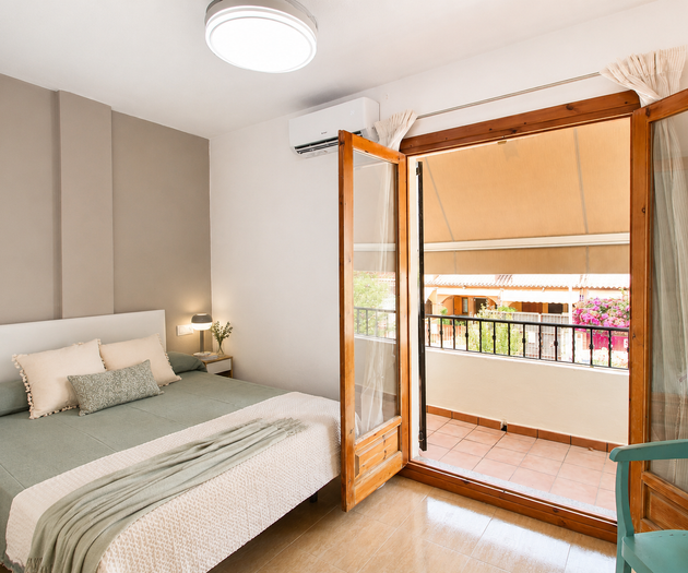 Bedroom with balcony access