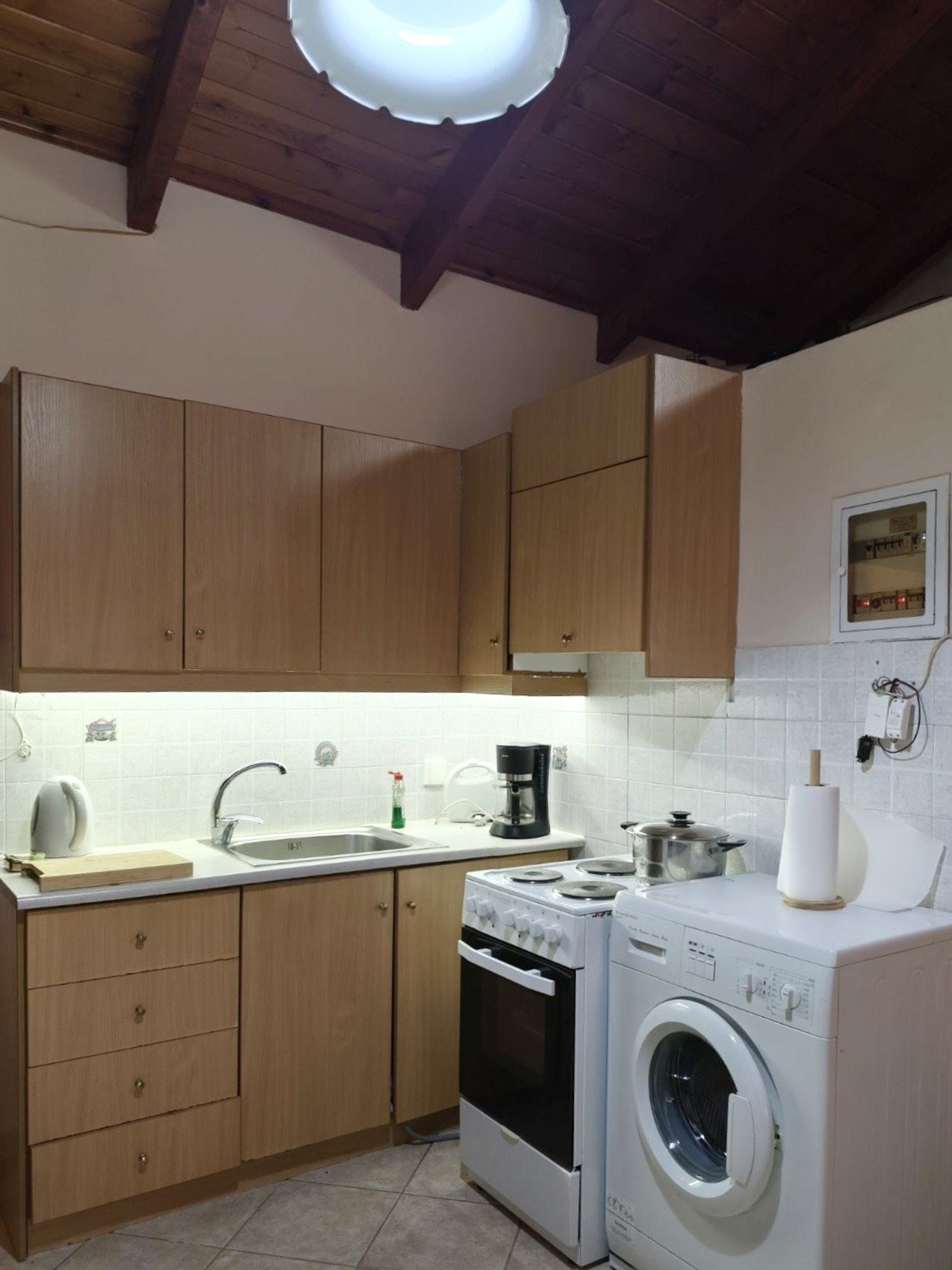 Kitchen with washer and stove