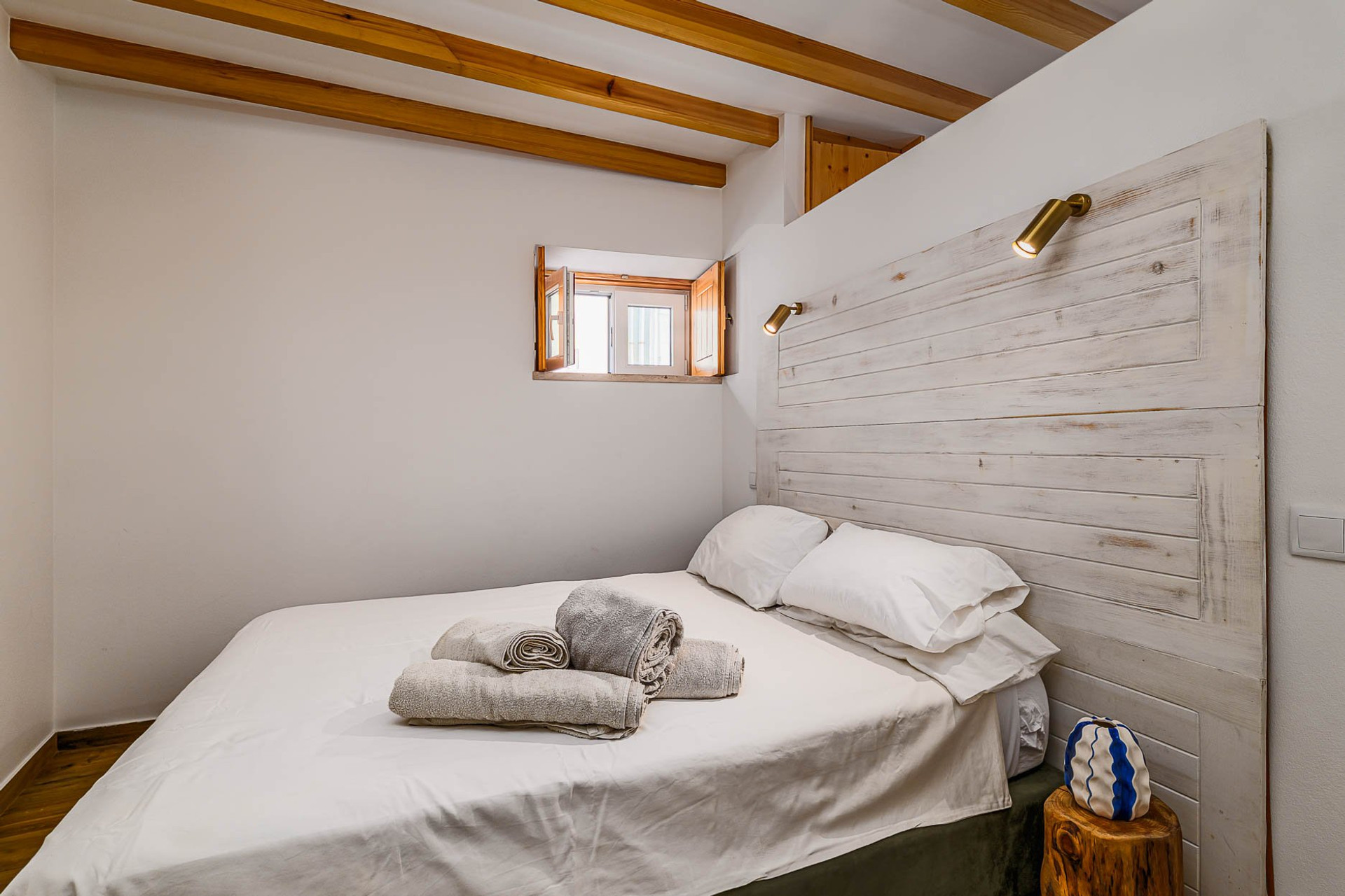 Bedroom with rustic headboard