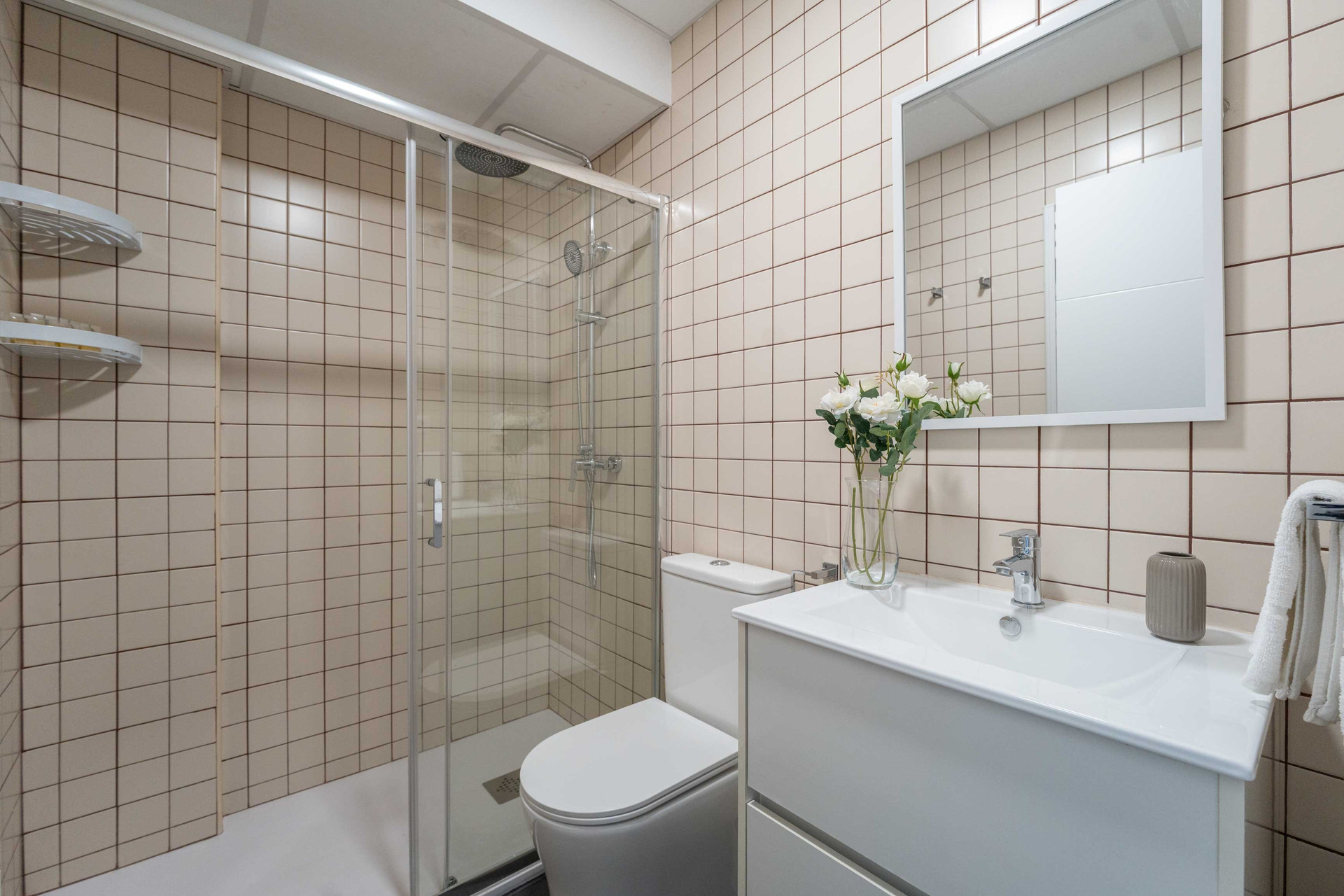 Bathroom with shower and vanity