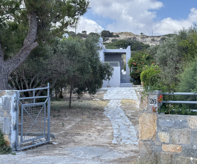 Villa entrance through stone gate