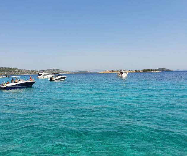 Turquoise sea with boats