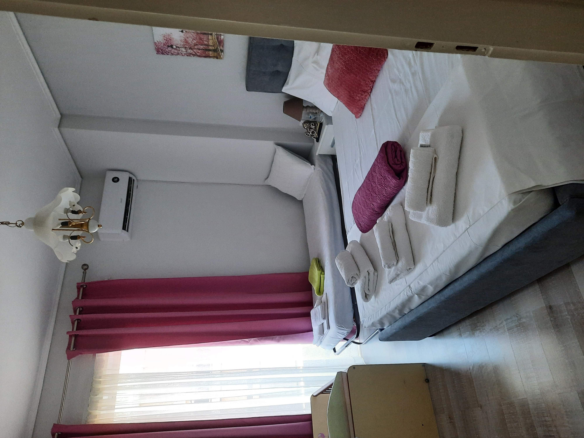 Bedroom with folded towels display