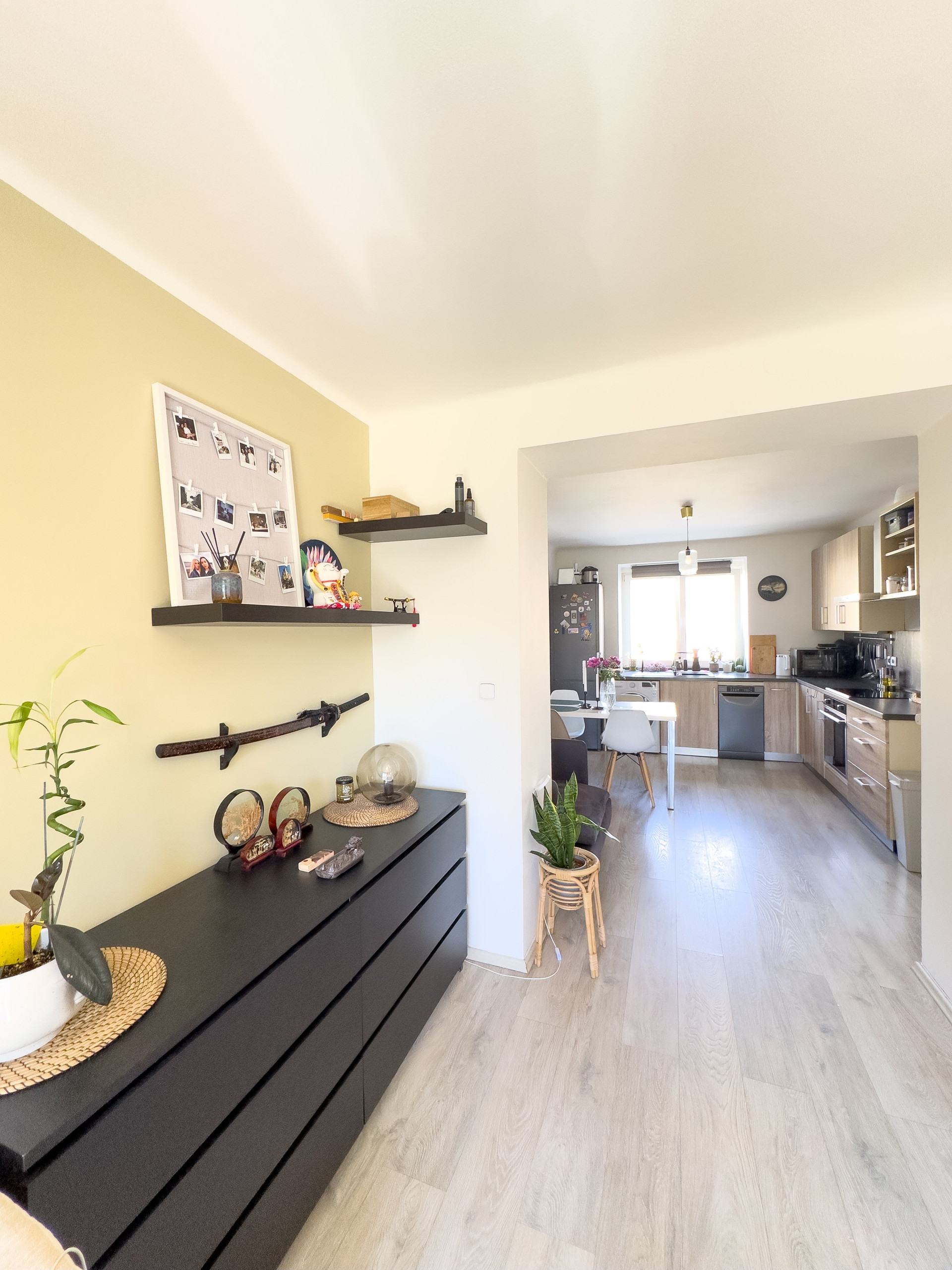 Living room toward bright kitchen