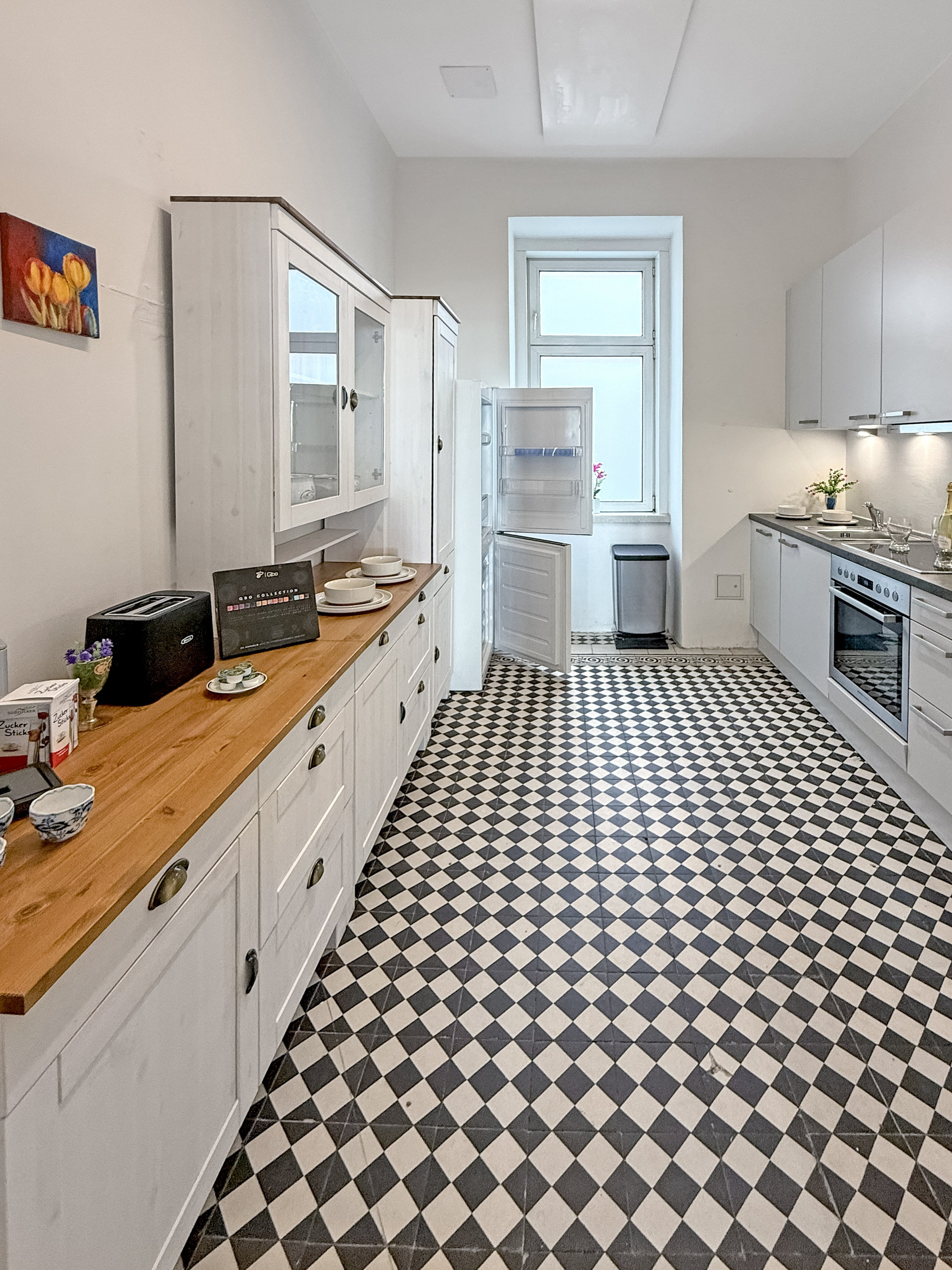 Kitchen with checkered tile floor