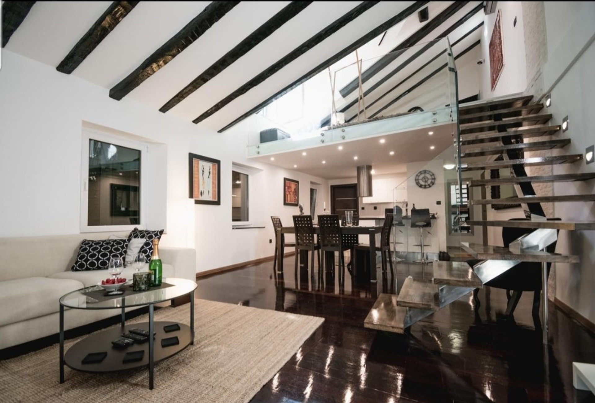 Open living area with loft stairs