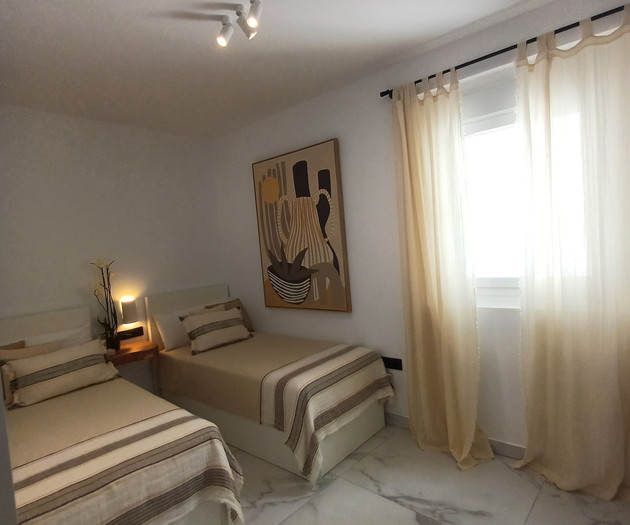 Twin bedroom with artwork
