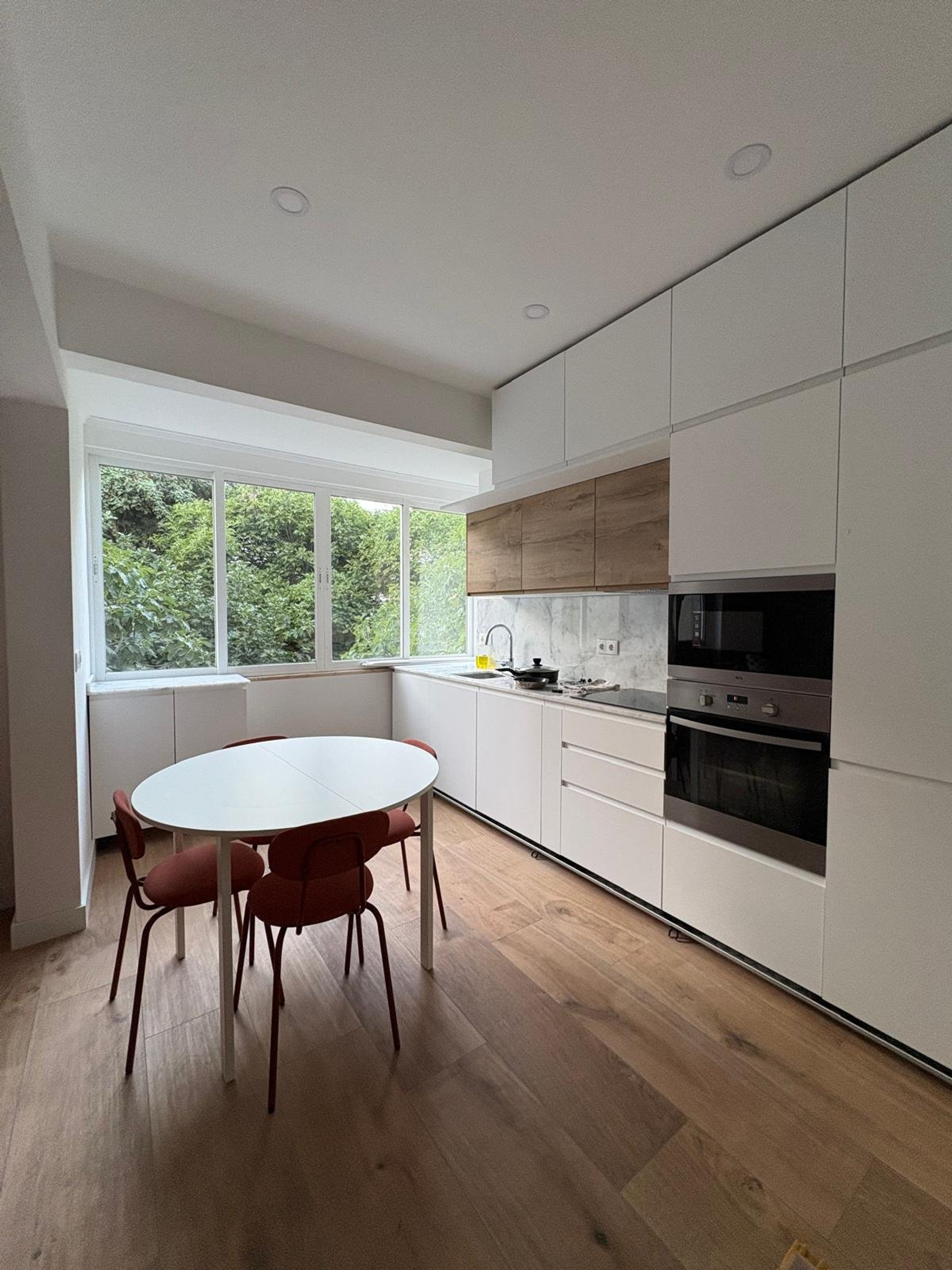 Modern kitchen with dining table