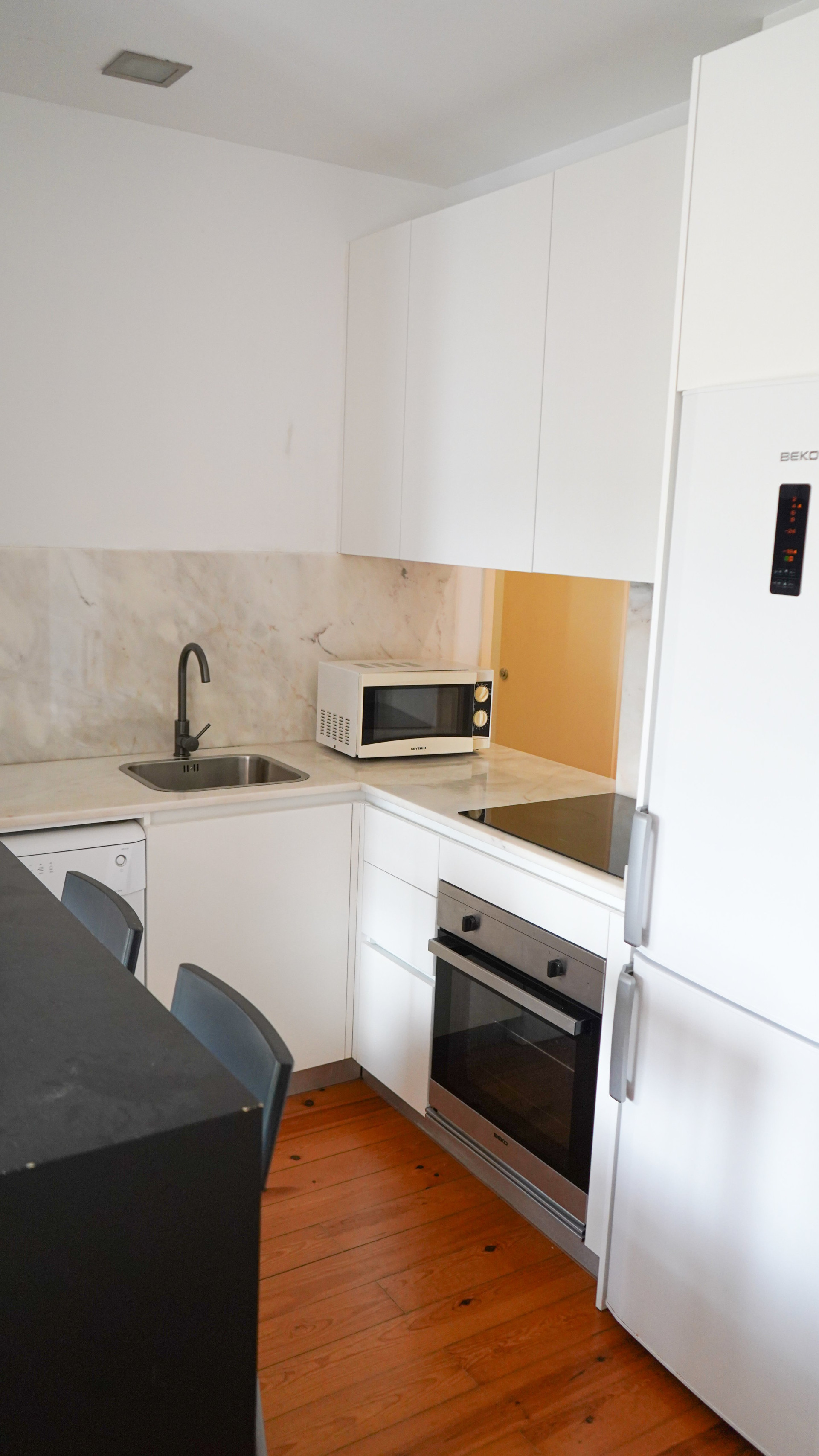 White kitchen oven sink marble counter