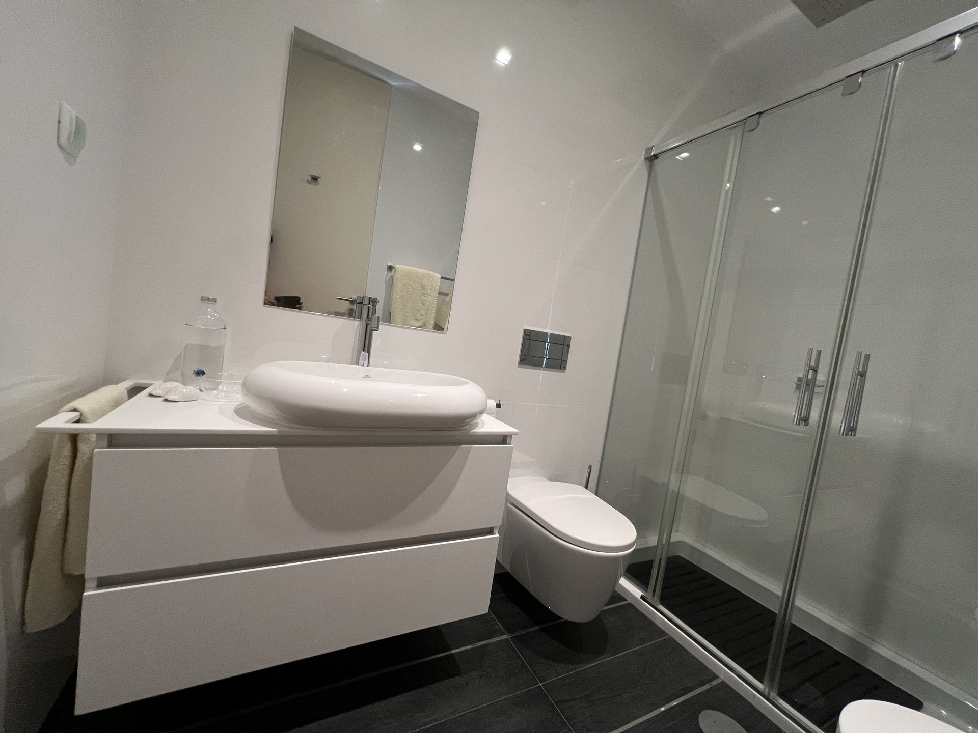 Clean white bathroom with shower