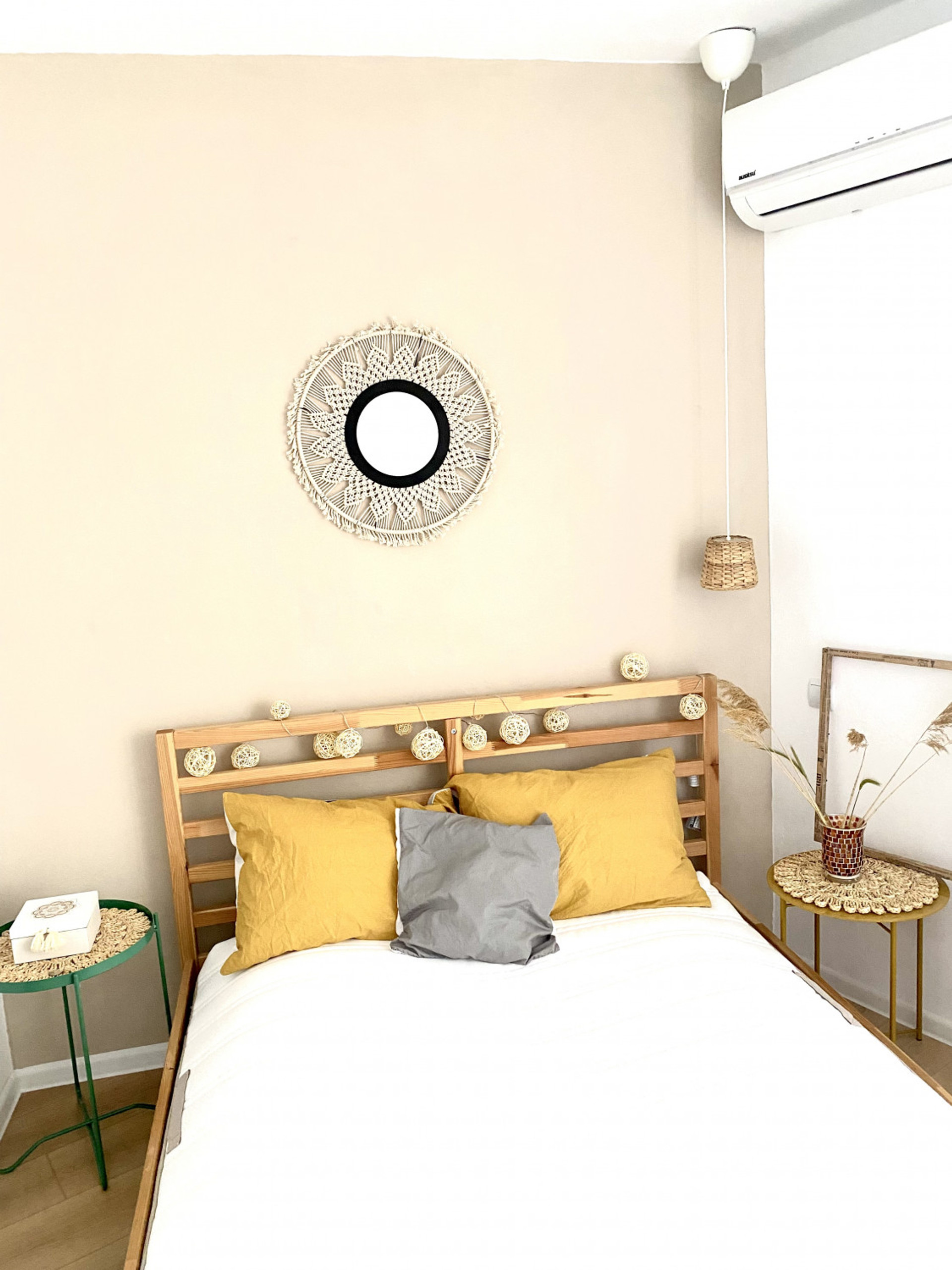 Boho bedroom with macrame mirror