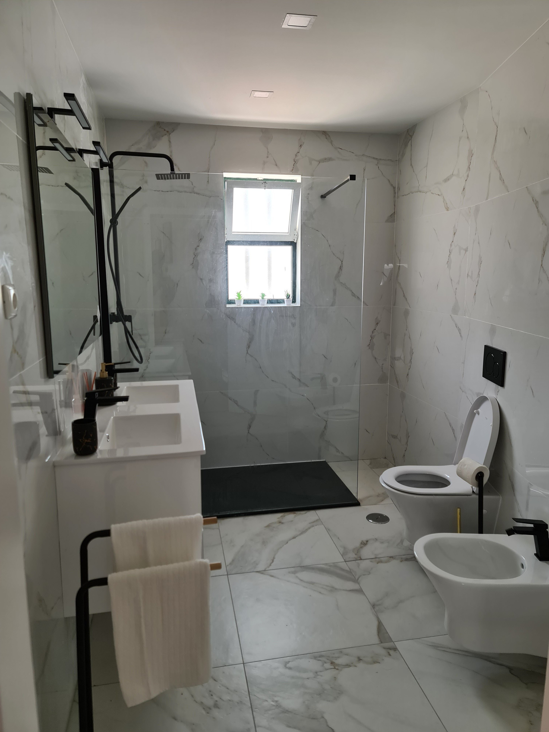 Marble bathroom with glass shower