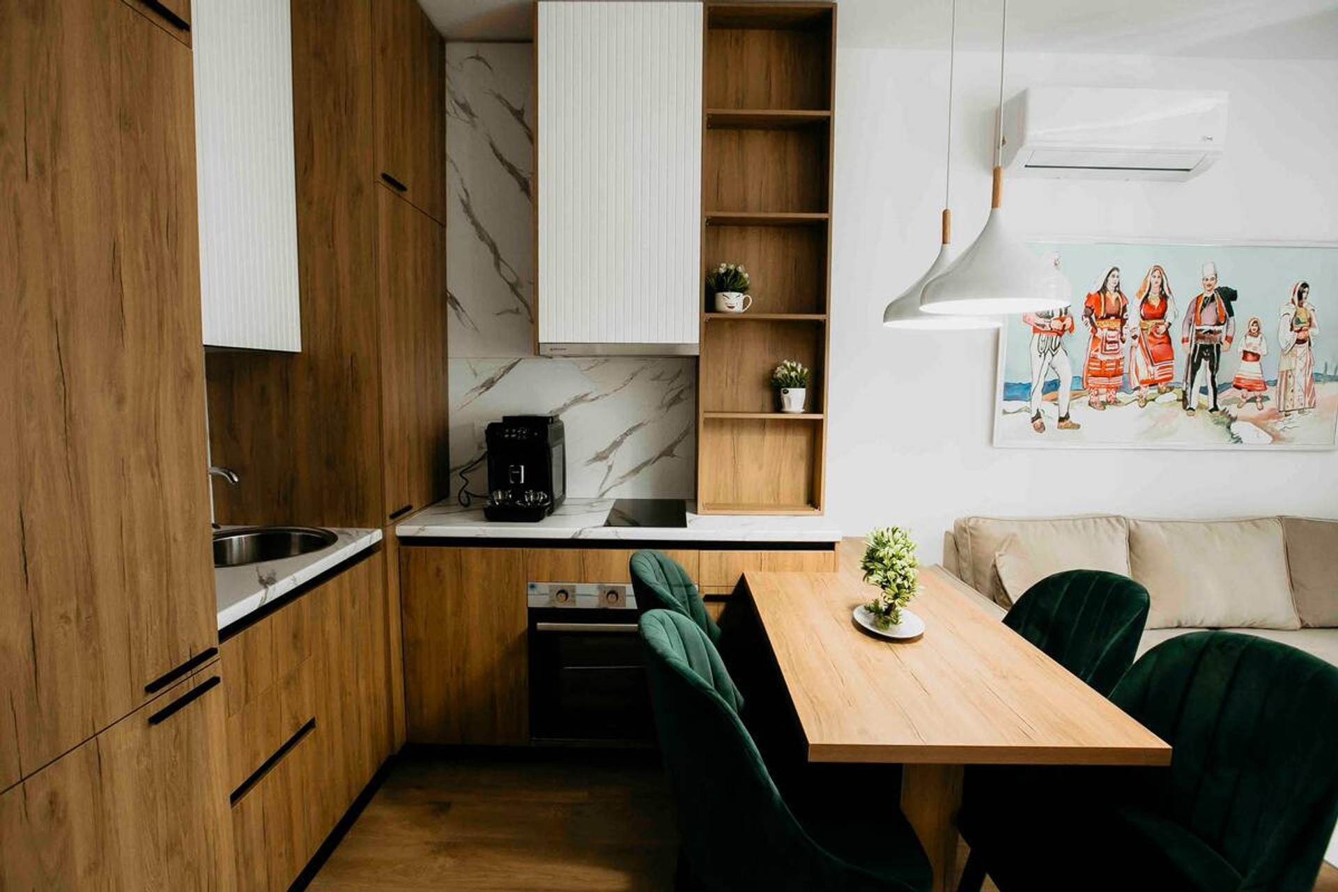 Fully equipped kitchen with dining area. Fridge with freezer compartment, dishwasher, oven, induction stove, and espresso machine with integrated grinder 😉