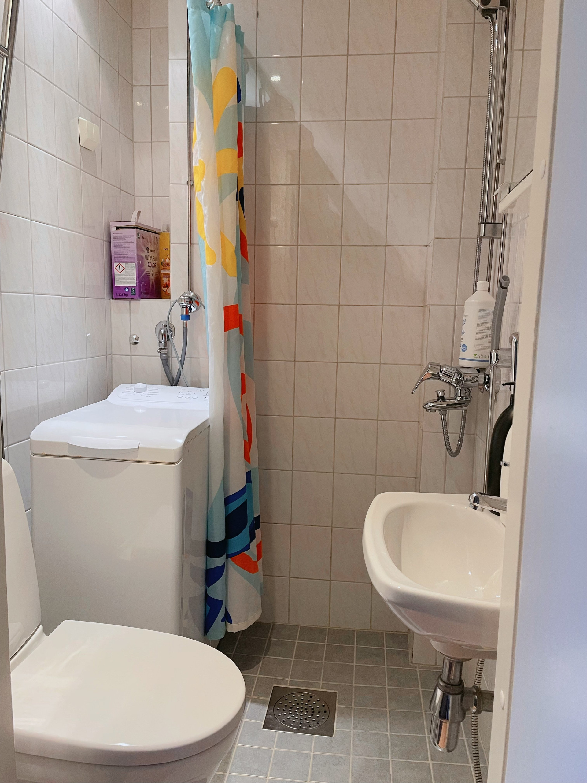Bathroom with shower and washer