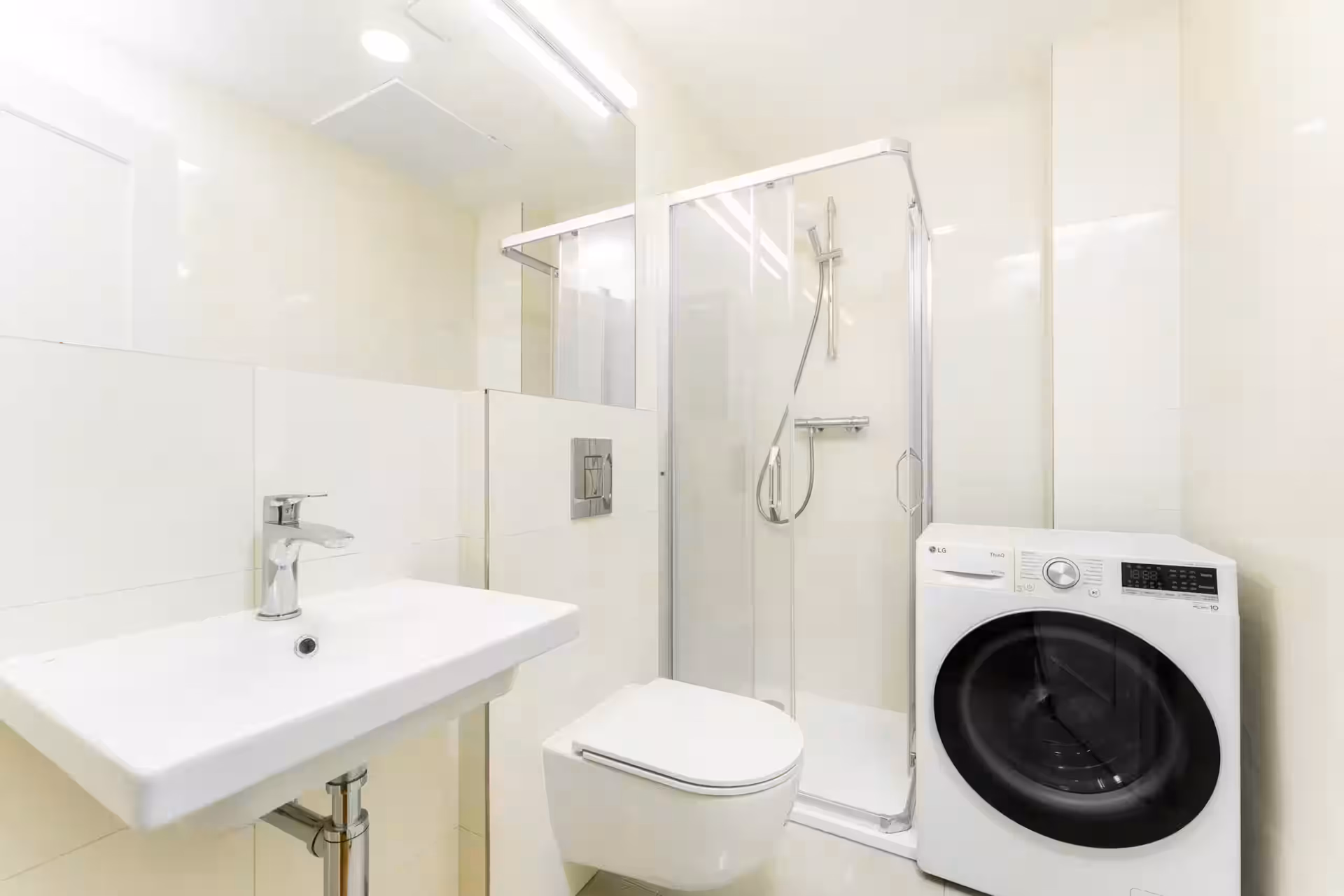 Bathroom with shower and washer