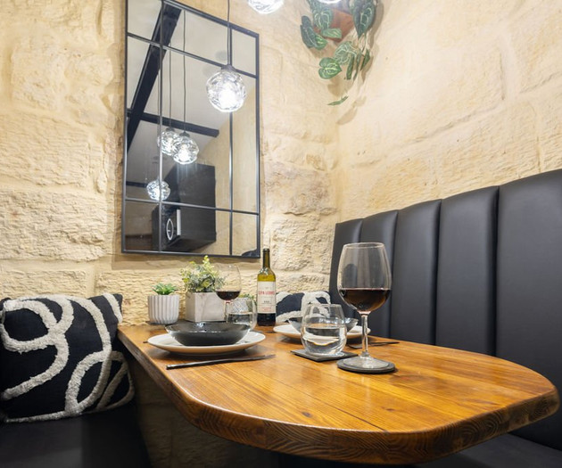 Cozy dining nook with wine