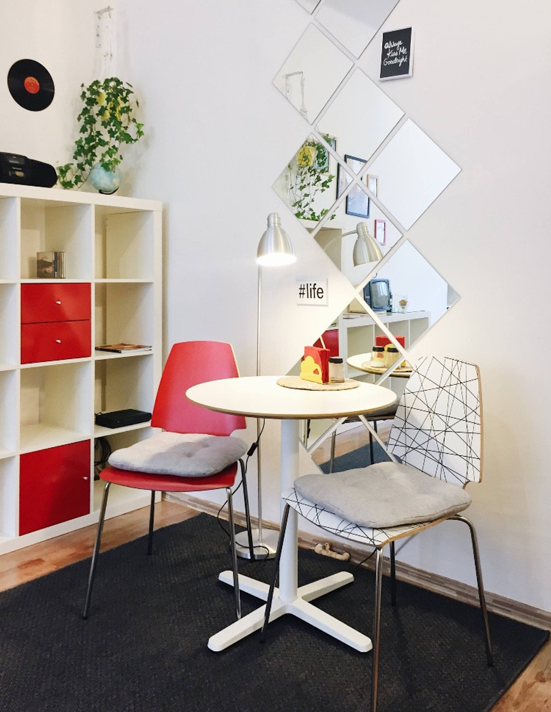Table, chairs and lamp for pleasant dinner or productive work