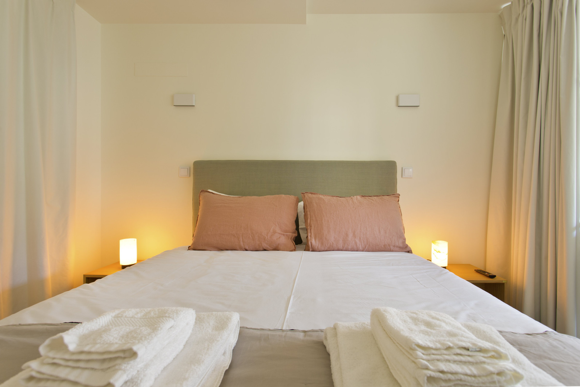 Cozy double bedroom with warm lighting