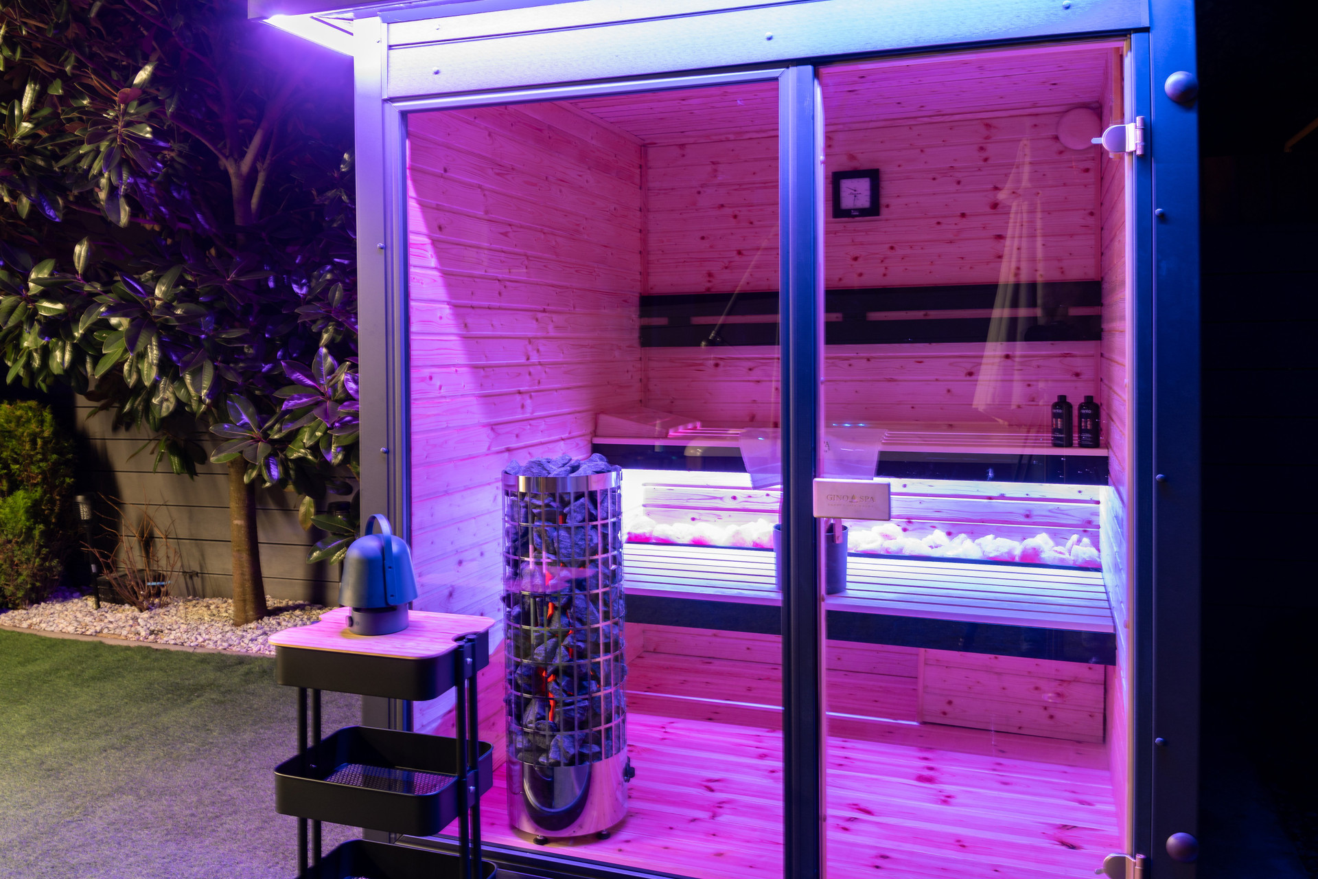 Private outdoor Finnish sauna with ambient LED lighting and a health-promoting salt wall. Always ready for use, complete with premium sauna oils for a full aromatherapy experience.