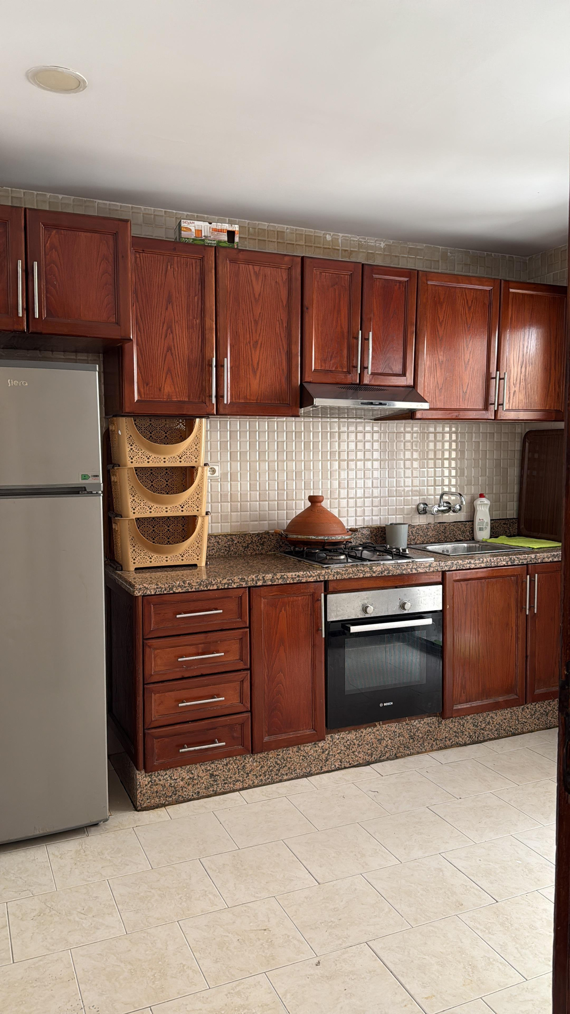 Full kitchen with oven fridge