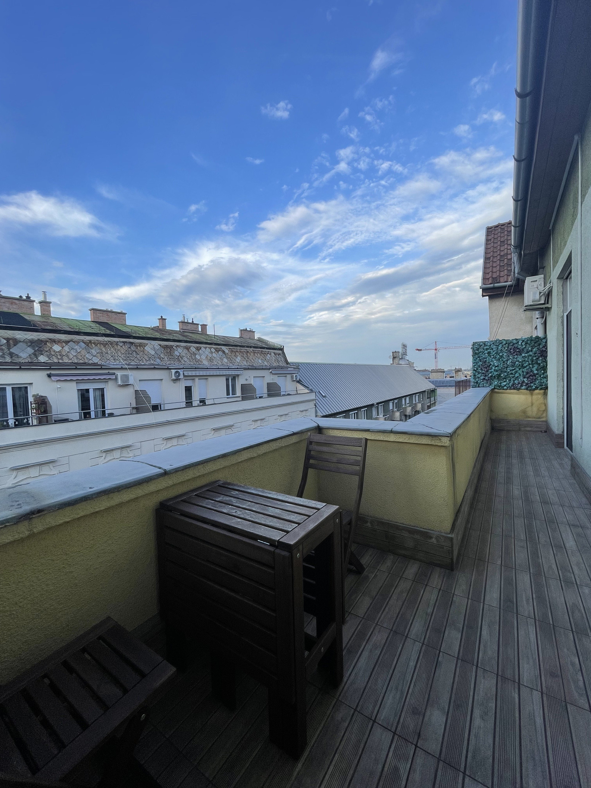 Balcony with city rooftop views