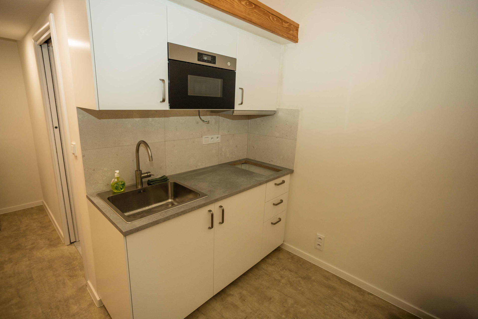 Kitchenette with sink and microwave