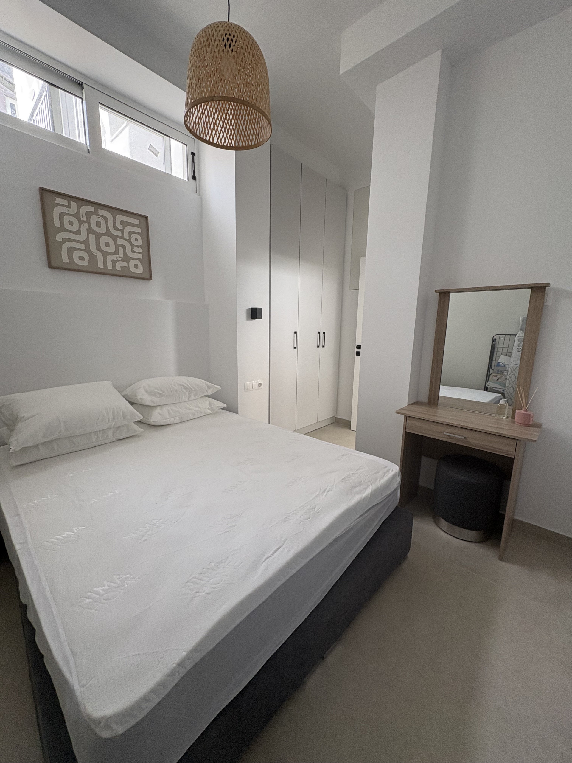 Bright bedroom with double bed