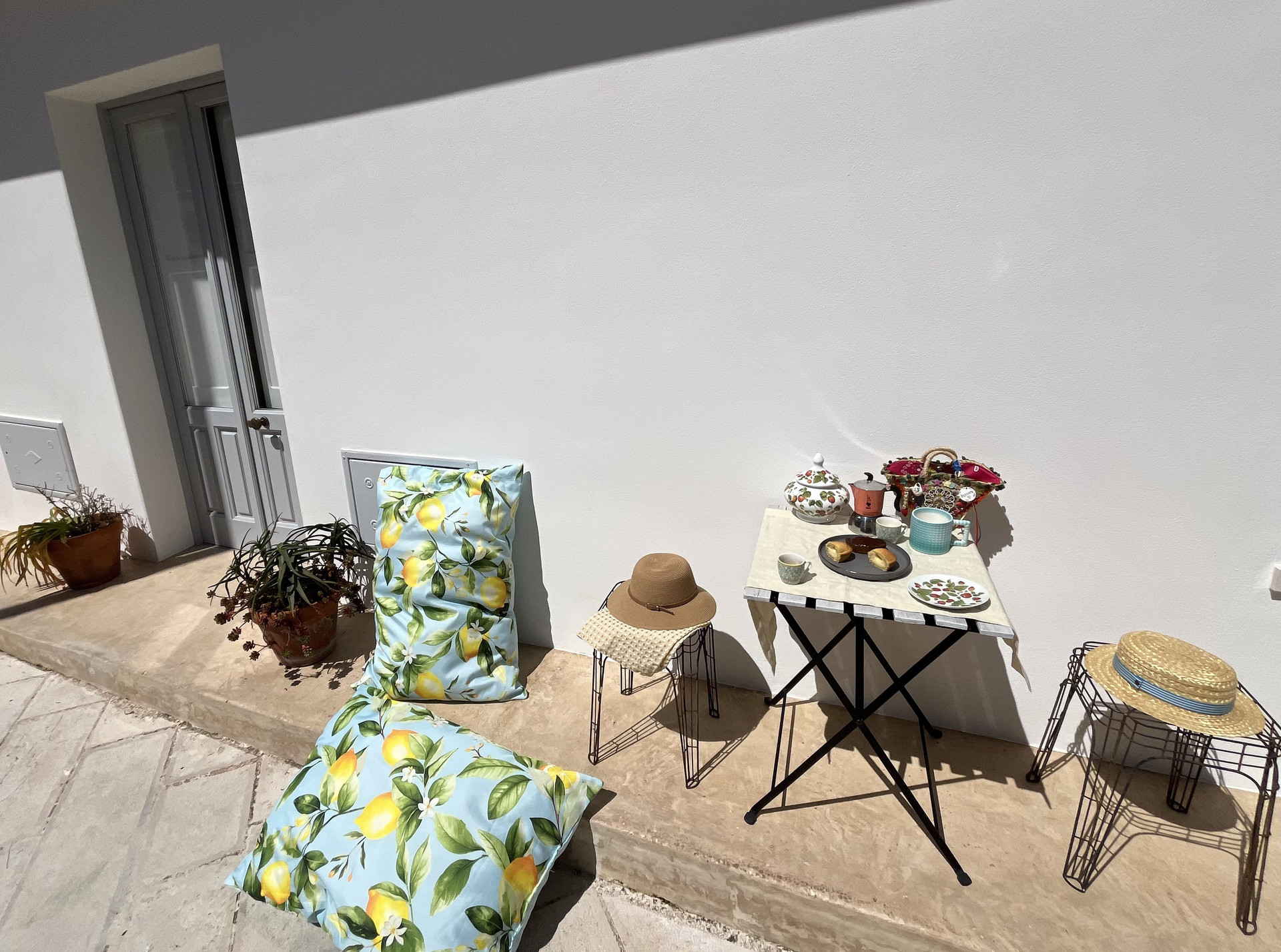 Sunny patio with lemon cushions