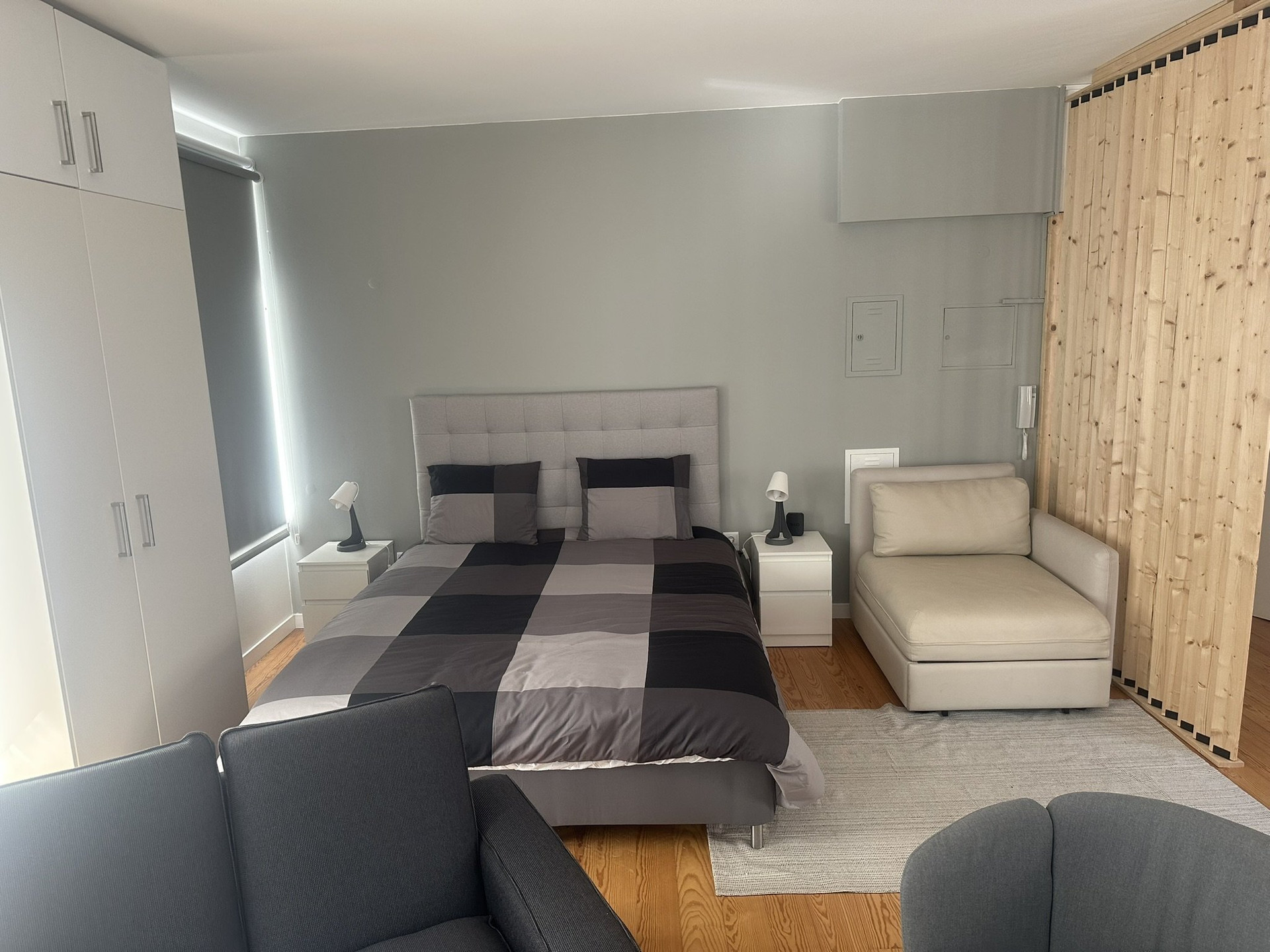 Spacious bedroom with wood partition
