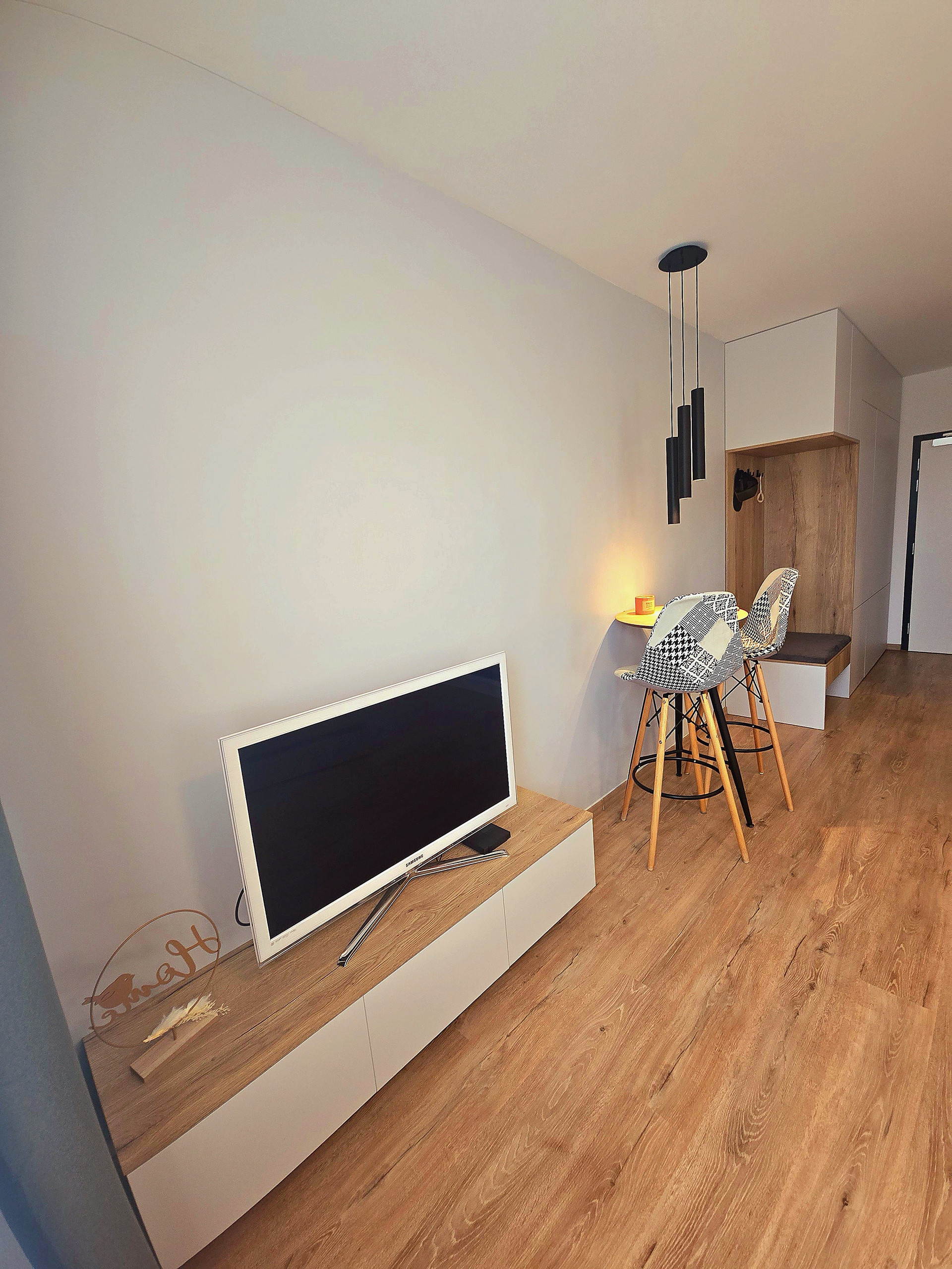 Living area with TV and dining