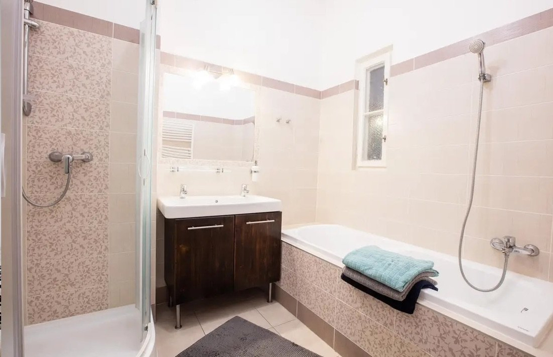 Bathroom with shower and bathtub