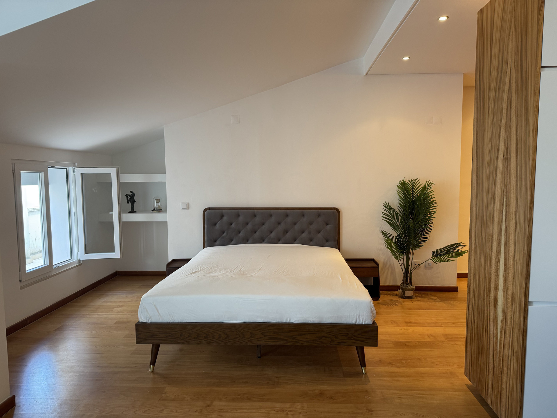 Bedroom with tufted headboard wardrobe