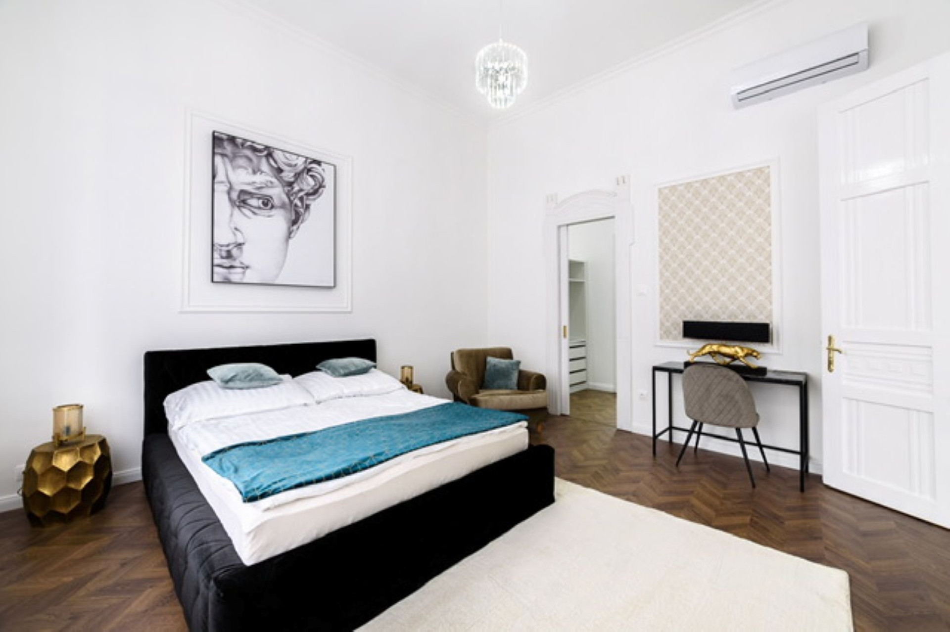 Elegant bedroom with desk workspace