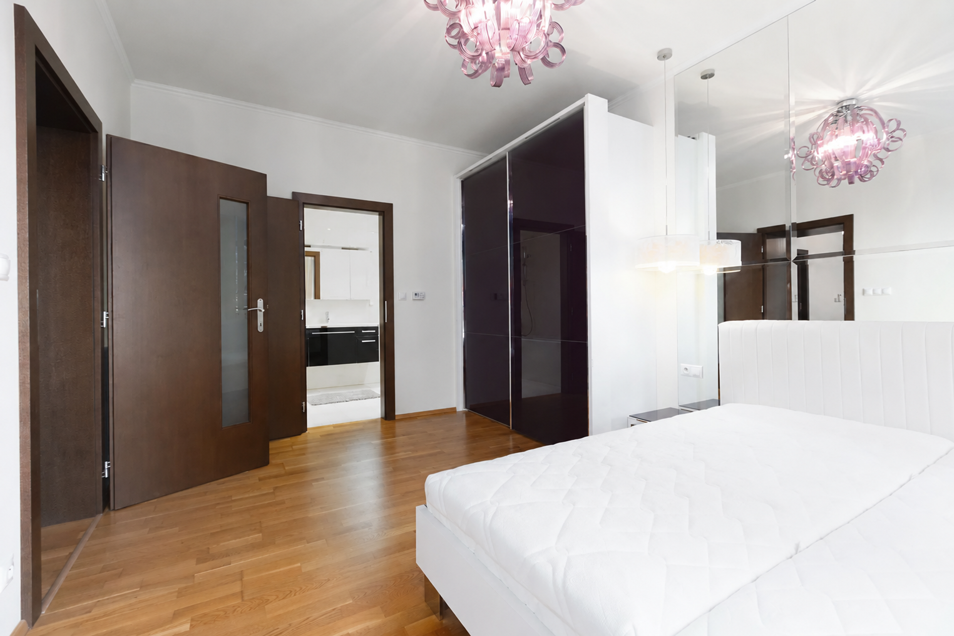 Bedroom with wardrobe and hallway