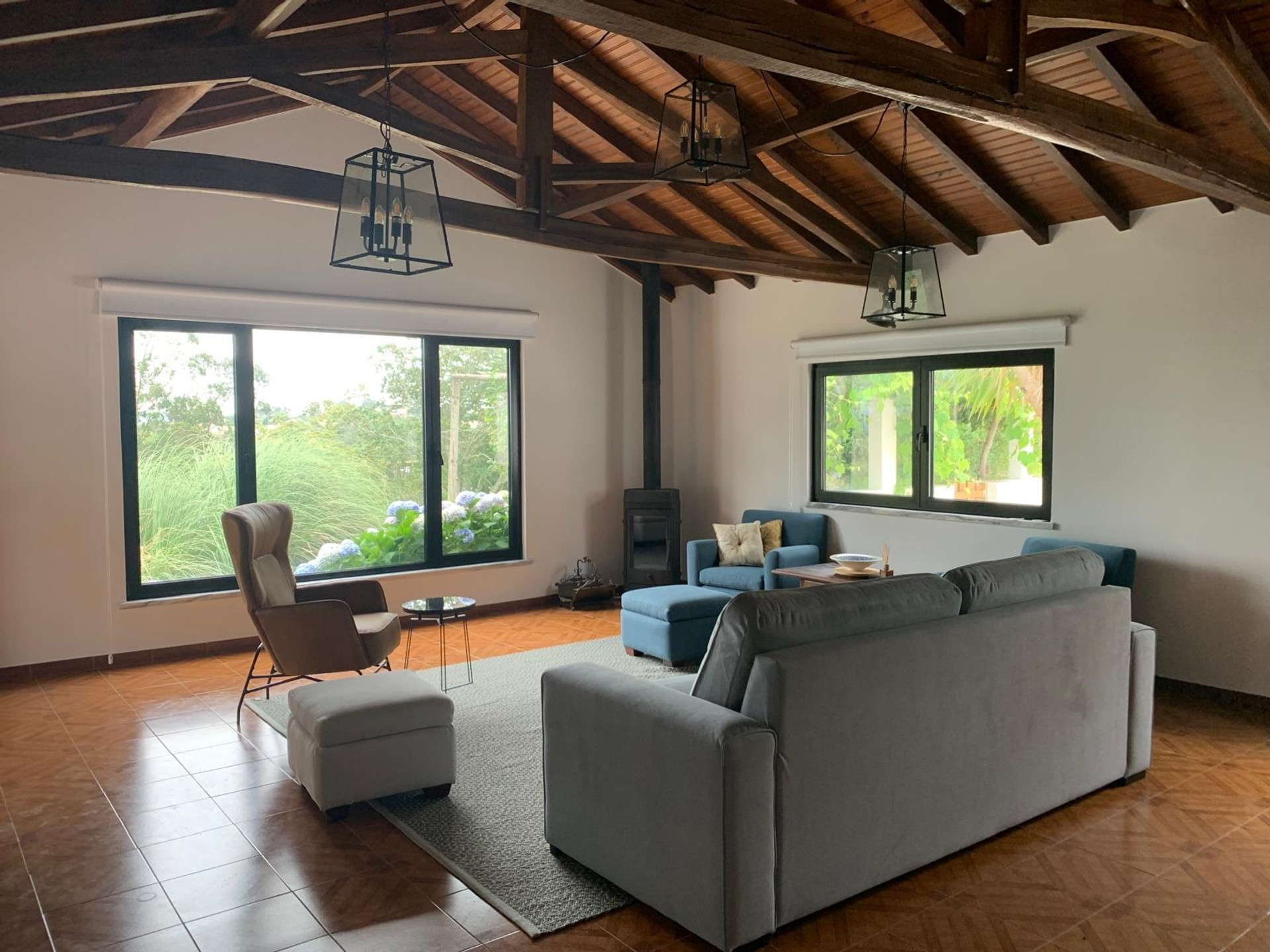 Spacious living room with vaulted wooden ceiling